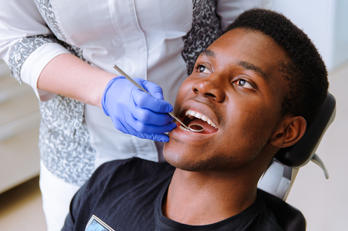 African male patient getting dental treatment in dental clinic
.