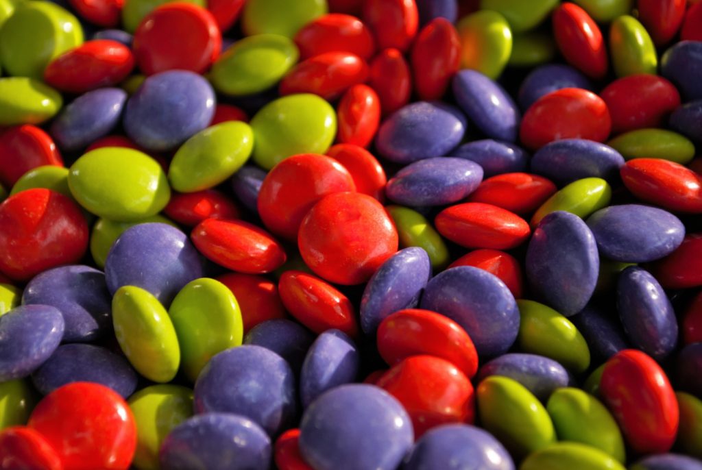 A close-up view of bite-sized milk chocolate Halloween candies, among the worst candy for teeth.