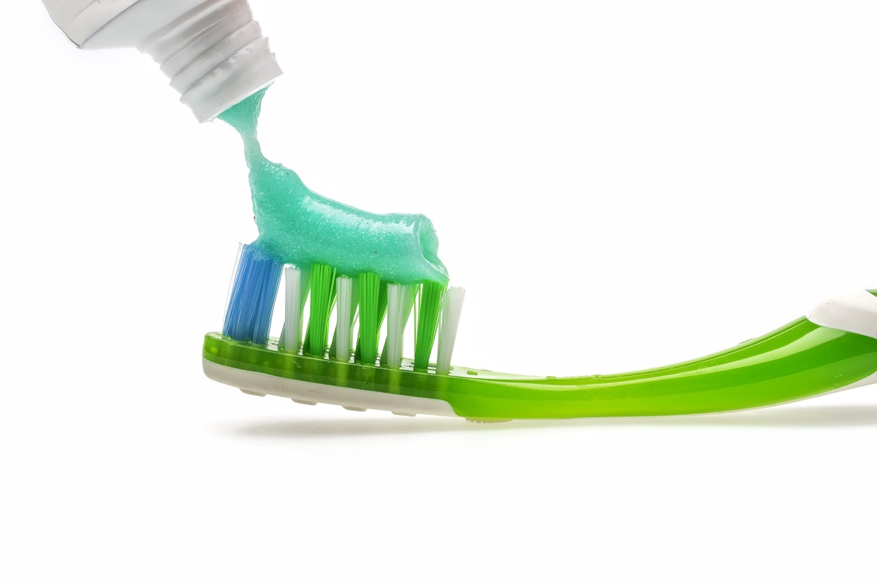 Toothbrush with fluoridated toothpaste on it. 