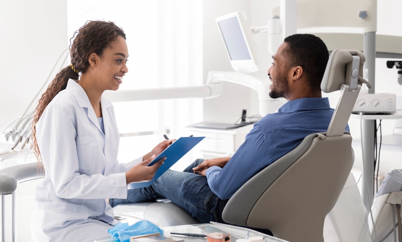 A man asks his female dentist about how to get rid of bad breath. 