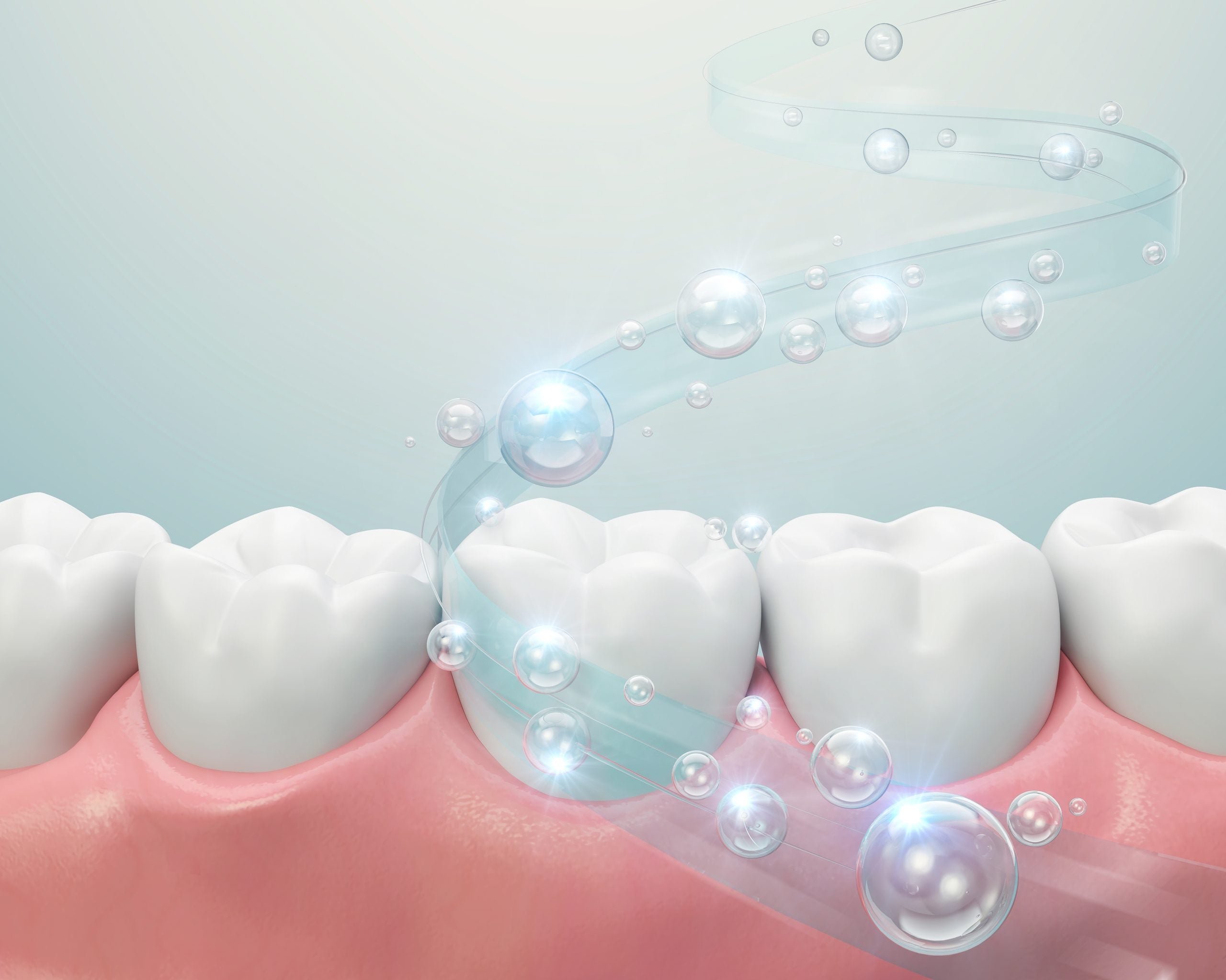 A swoosh of fluoride bubbles across teeth and gums. 