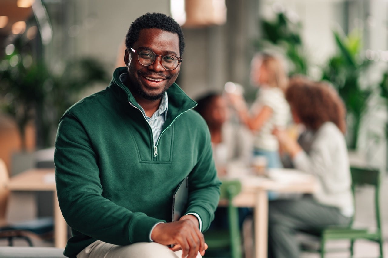 A man smiles now that he has talked to his dentist about his HPV and oral cancer concerns. 